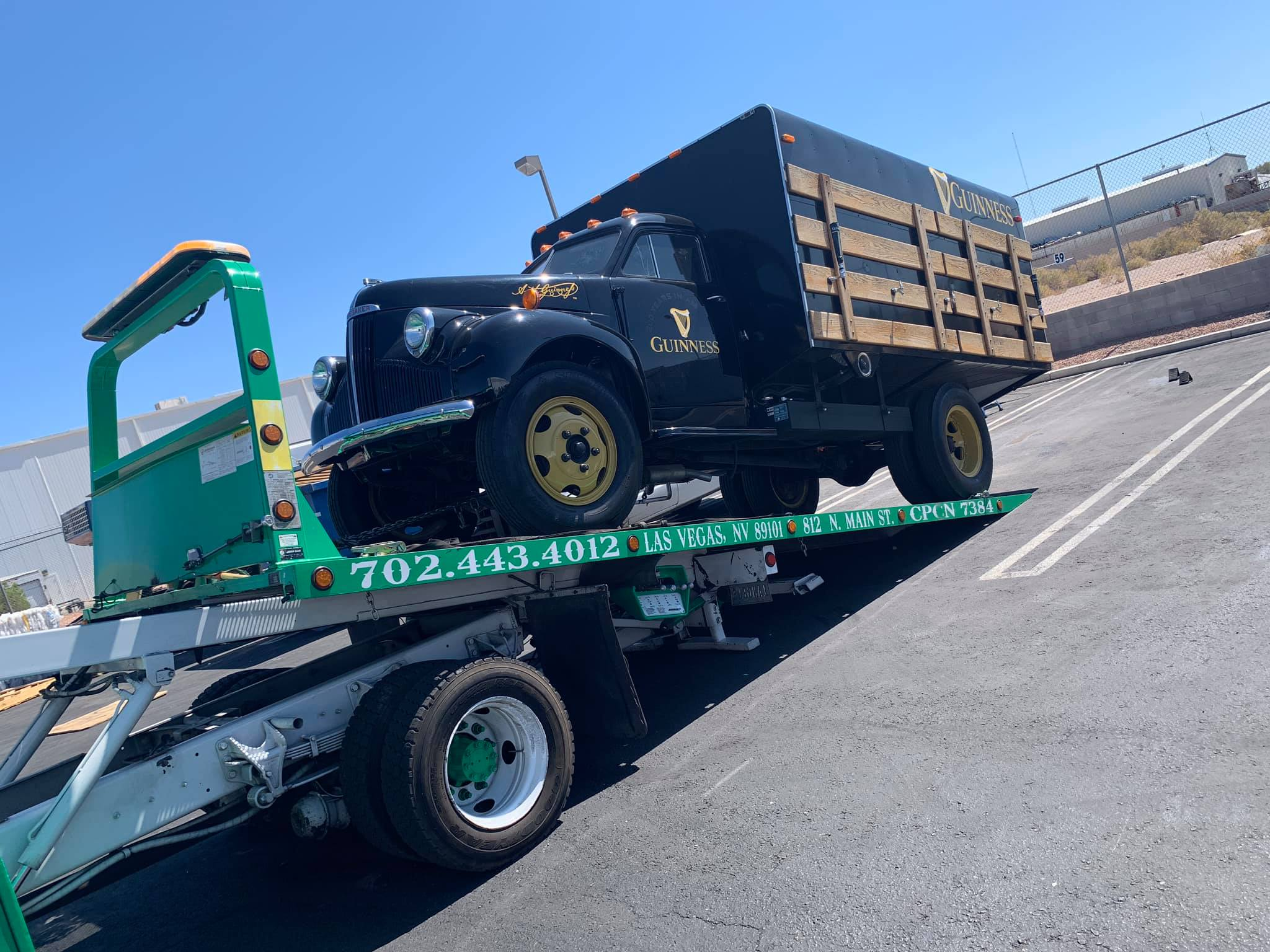 6 Angels flatbed transporting a vintage commercial truck